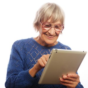 bigstock-Senior-happy-woman-using-ipad-73149421.jpg