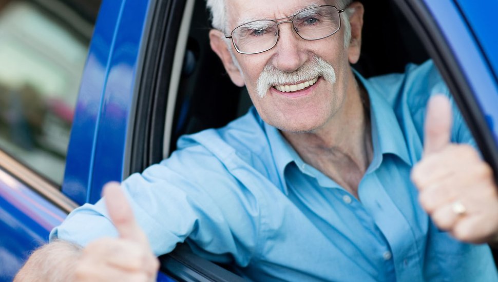 bigstock-Man-driving-a-car-and-showing-37191019.jpg