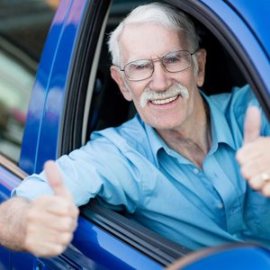 bigstock-Man-driving-a-car-and-showing-37191019.jpg