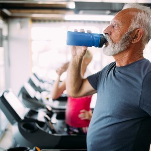 bigstock-Senior-Man-Drinking-Bottle-Of--316948033.jpg