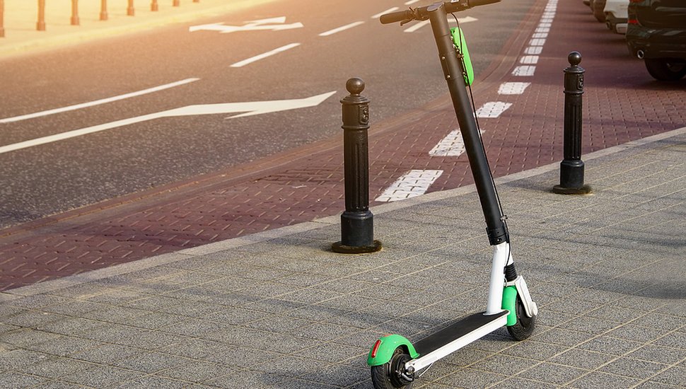 bigstock-Electric-Scooter-Parked-On-The-368859268.jpg
