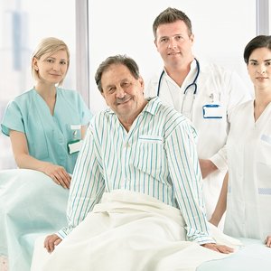 bigstock-Older-patient-sitting-on-bed-w-13112603.jpg