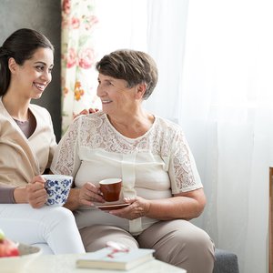 bigstock-Senior-Lady-Serving-Tea-203066623.jpg