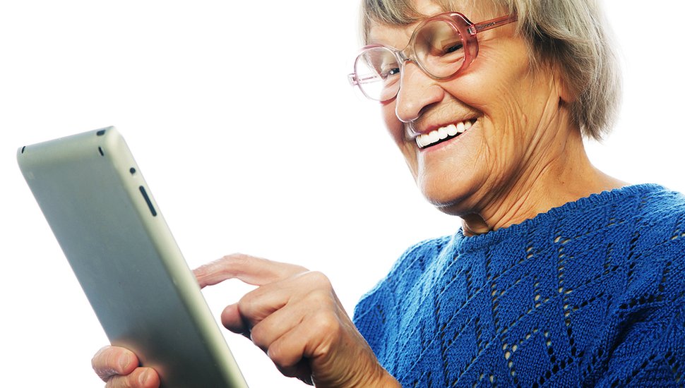 bigstock-Senior-happy-woman-using-ipad--101416313.jpg