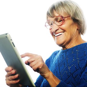 bigstock-Senior-happy-woman-using-ipad--101416313.jpg