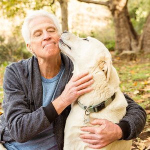bigstock-Senior-man-with-his-dog-in-par-106459166.jpg