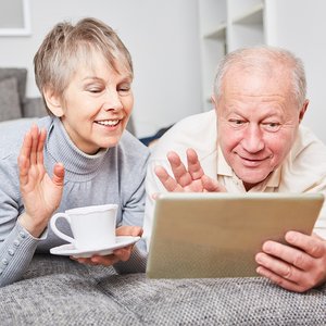 bigstock-Seniors-video-chatting-with-ta-252589519.jpg